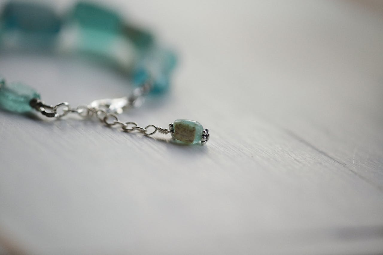 discover Close-up of a delicate gemstone bracelet with soft focus effect.